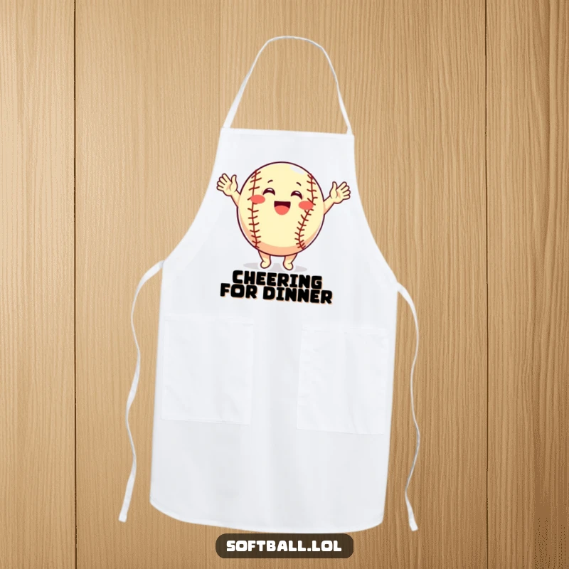 Funny Apron: A softball character cheers with raised arms, bringing excitement and a celebratory vibe to kitchen tasks.