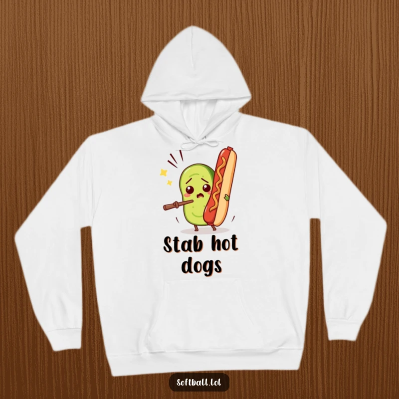 Funny hoodie depicting a confused pickle slice comically trying to bat away a flying hot dog, cozy and humorous apparel.